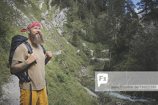 Bearded man wearing bandana standing in forest  Otschergraben  Austria