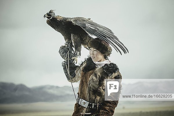 Portrait of a young eagle hunter Festival of eagle hunters in the province of Olgii about 20 km from the provincial capital Olgii Mongolia Asia