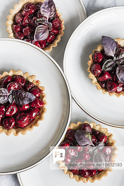 Cherry tartlets with red basil