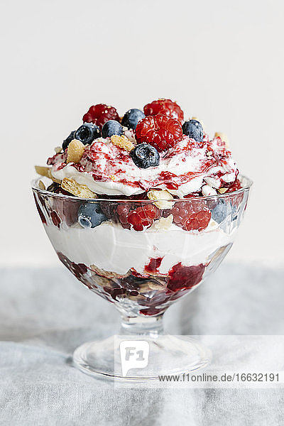 Trifle with vanilla shortbread  cream  meringue  raspberries and blueberries