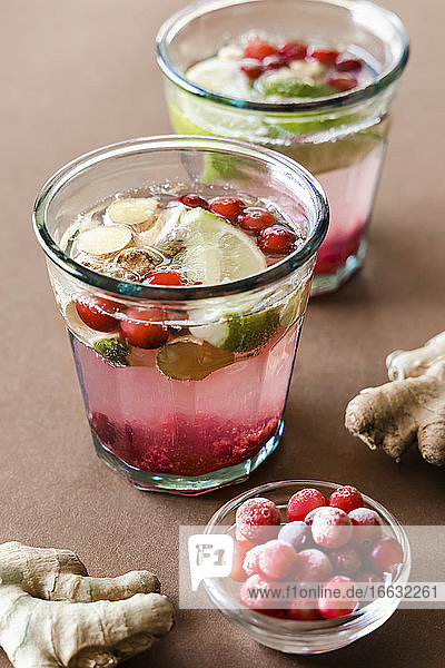 Ginger and cranberry drinks with honey and lime