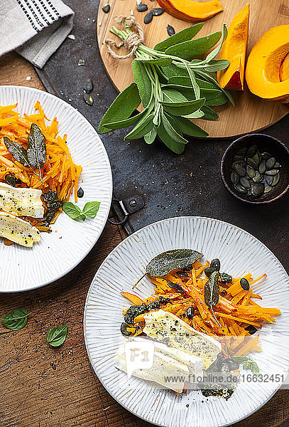 Pumpkin strips with pesto and cheese
