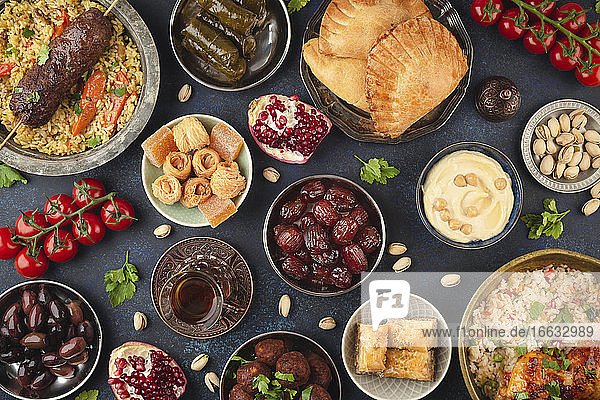 Ramadan kareem Iftar party table with assorted festive traditional Arab dishes  sweets  dates