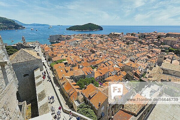 Dubrovnik  Dubrovnik-Neretva County  Croatia. View over rooftops of the old town from the Minceta Tower. Boats in the Old Port. Cruise boats under way. The old city of Dubrovnik is a UNESCO World Heritage Site.