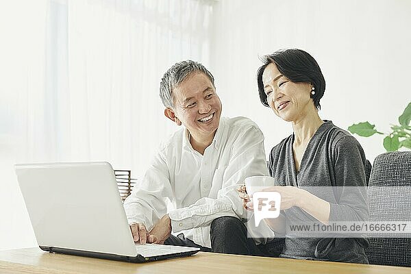 Japanese Senior Couple In The Room