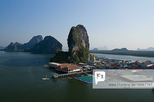 Aerial view  wooden house settlement  pile dwelling village with high karst rocks in the background  Ao Phang-Nga National Park  Phang-Nga Province  Thailand  Asia