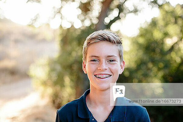 Smiling Portrait Of A Young Teen Boy With Braces