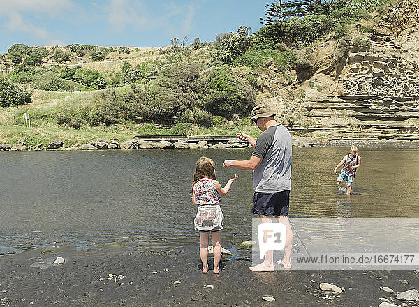 Family fishing at a scenic river spot