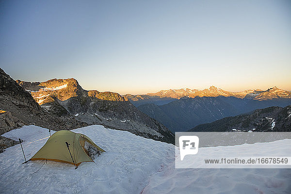 Tent perched on glacier in the North Cascade Mountain Range