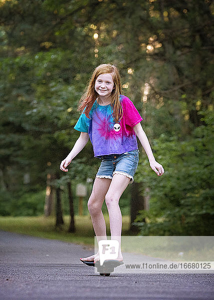 Pre Teen Red Haired Girl Ripsticking