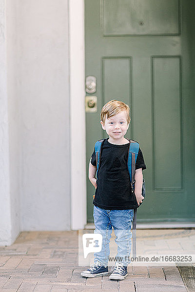 First day of preschool photo at home with backpack