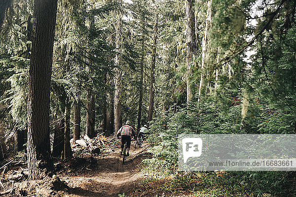 Two bikers ride the trails at a bike park on Mt. Hood  Oregon.