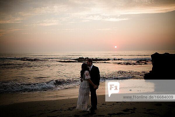 Newlyweds Posing on Beach at Sunset in San Diego
