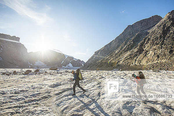 Two climber cross a glacier in Auyuittuq National Park