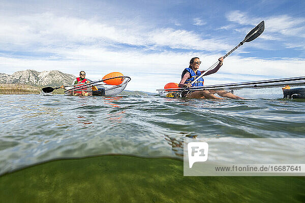 Kayakers enjoying a summer morning paddling on Lake Tahoe  CA
