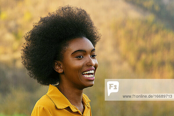 afro american woman smiling happy in nature