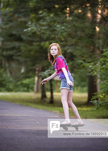Pre Teen Red Haired Girl Ripsticking