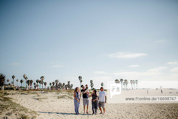 Family of Five Walking on Beach