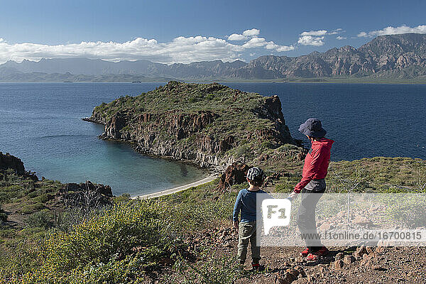 A woman and her son on a hill at Del Carmen Island in Loreto Bay