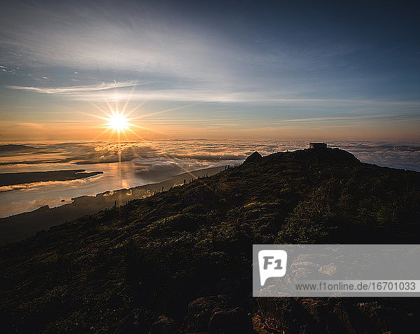 Sunrise over a misty Flagstaff Lake from summit of Bigelow Mountain.