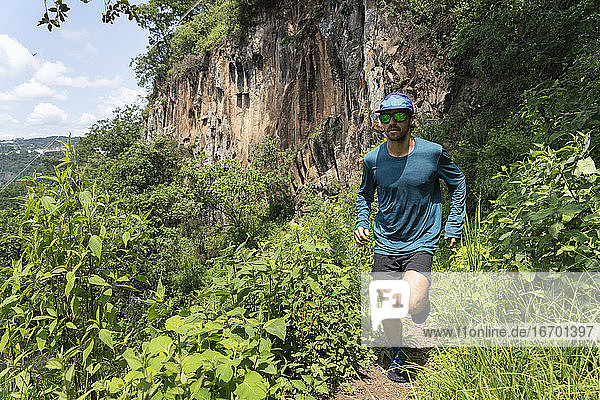 One young man running on a trail in the mountains of Zacatlan  Puebla