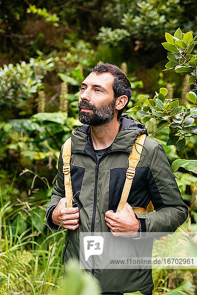 Young man backpacking enjoying in nature