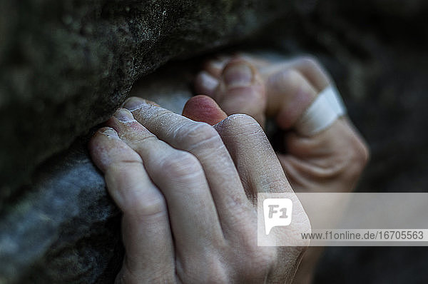 Rock climber's hands on handhold