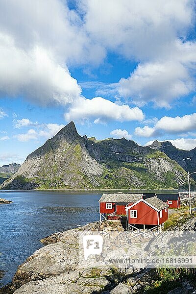 Rorbuer fishing cabins from Hamnøy  Reinefjord with mountains in the background  Reine  Lofoten  Norway  Europe