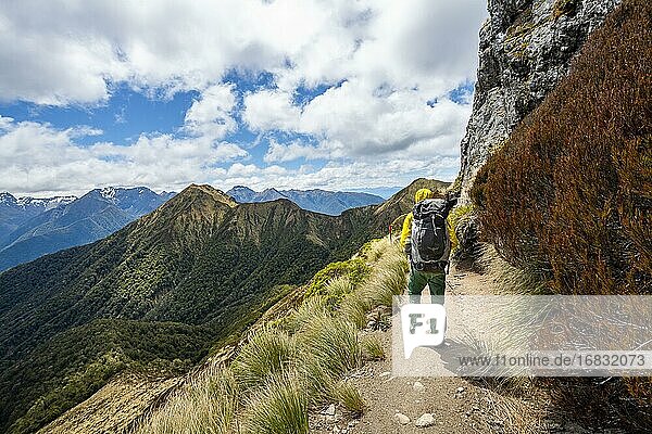 Hiker on Kepler Track  Great Walk  views of Murchison Mountains  Fiordland National Park  Southland  New Zealand  Oceania