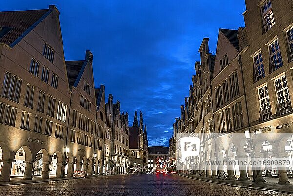 Illuminated historic gabled houses in the evening at blue hour  Prinzipalmarkt  Münster  North Rhine-Westphalia  Germany  Europe
