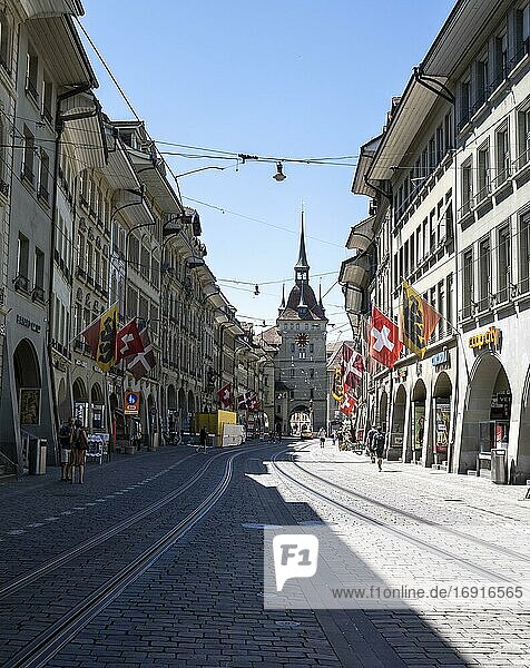 Flags on a row of houses in the old town of Bern  clock tower Zytglogge in the back  Inner City  Bern  Canton Bern  Switzerland  Europe