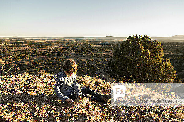 young boy in Galisteo Basin at sunset   Santa Fe