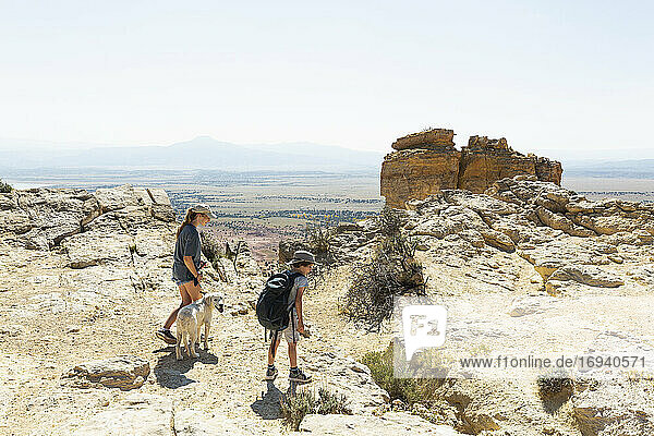 children hiking on Chimney Rock trail  through a protected canyon landscape