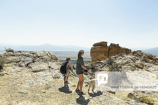 children hiking on Chimney Rock trail  through a protected canyon landscape