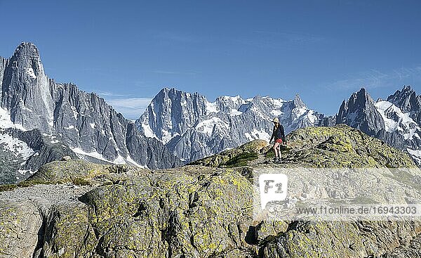 Hiker on a hiking trail  Grand Balcon Sud  mountain peaks  Grandes Jorasse  Mont Blanc massif  Chamonix-Mont-Blanc  Haute-Savoie  France  Europe
