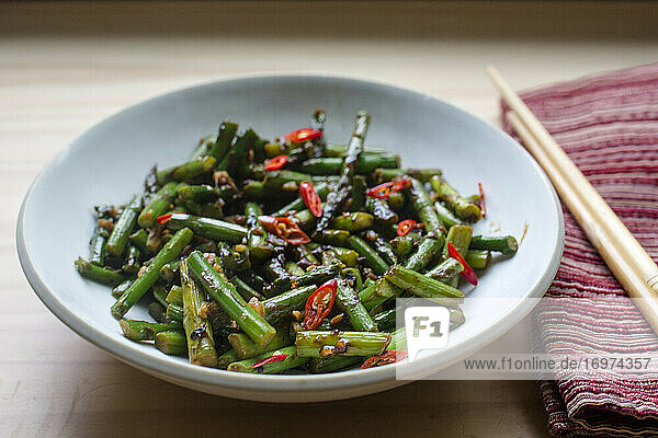 Bowl of spicy asian vegetables in window light