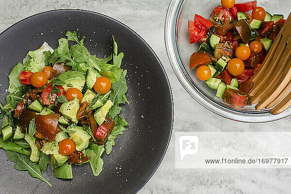 Above-view of plated fresh vegetable salad on table