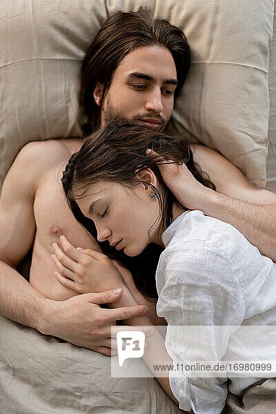 Portrait Of A Sleeping Couple together in their home.