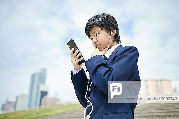 Happy Japanese teenager outdoors