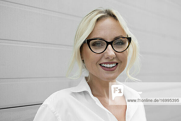 Portrait happy  beautiful businesswoman in eyeglasses