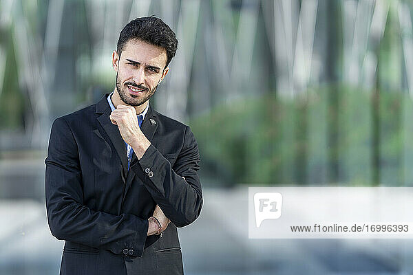 Businessman staring while standing outdoors