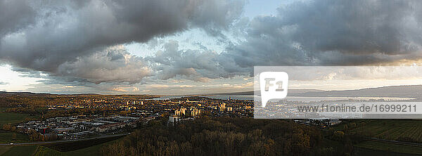 Germany  Baden-Wurttemberg  Radolfzell  Gray clouds over lakeshore town in autumn