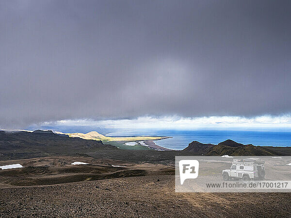 Gray clouds over off-road car in Snaefellsjokull National Park  Iceland