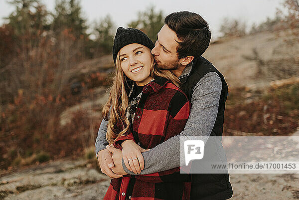 Young couple embracing during autumn hike
