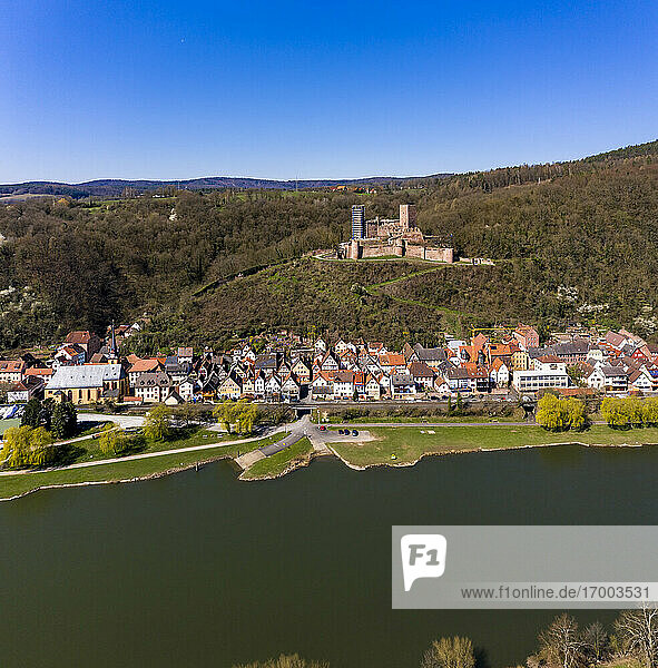 Germany  Bavaria  Stadtprozelten  Helicopter view of riverside town in autumn with Henneburg castle in background