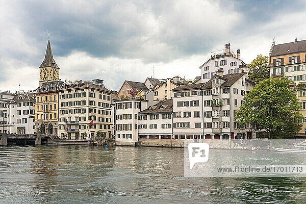 Switzerland  Zurich  Limmat river with old town buildings and St Peters church