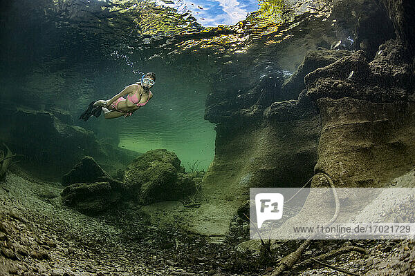 Teenage girl snorkeling in Traun river