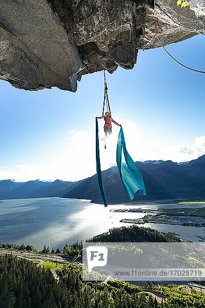 Woman on aerial silks on the Stawamus Chief in Squamish  British Columbia  Canada