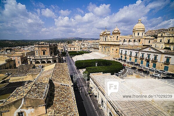 Elevated view of St Nicholas Cathedral (Noto Cathedral  Cattedrale di Noto) and the Town Hall (Municipio)  Municipio Square  Noto  Val di Noto  UNESCO World Heritage Site  Sicily  Italy  Europe. This is a photo of St Nicholas Cathedral (Noto Cathedral  Cattedrale di Noto) and the Town Hall (Municipio) in Municipio Square. St Nicholas Cathedral (Noto Cathedral  Cattedrale di Noto) in Noto is a building typical of the Sicilian Baroque style of architecture.