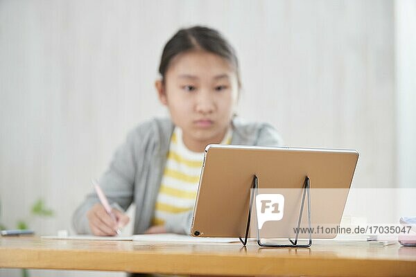 Japanese junior high schoolgirl studying remotely